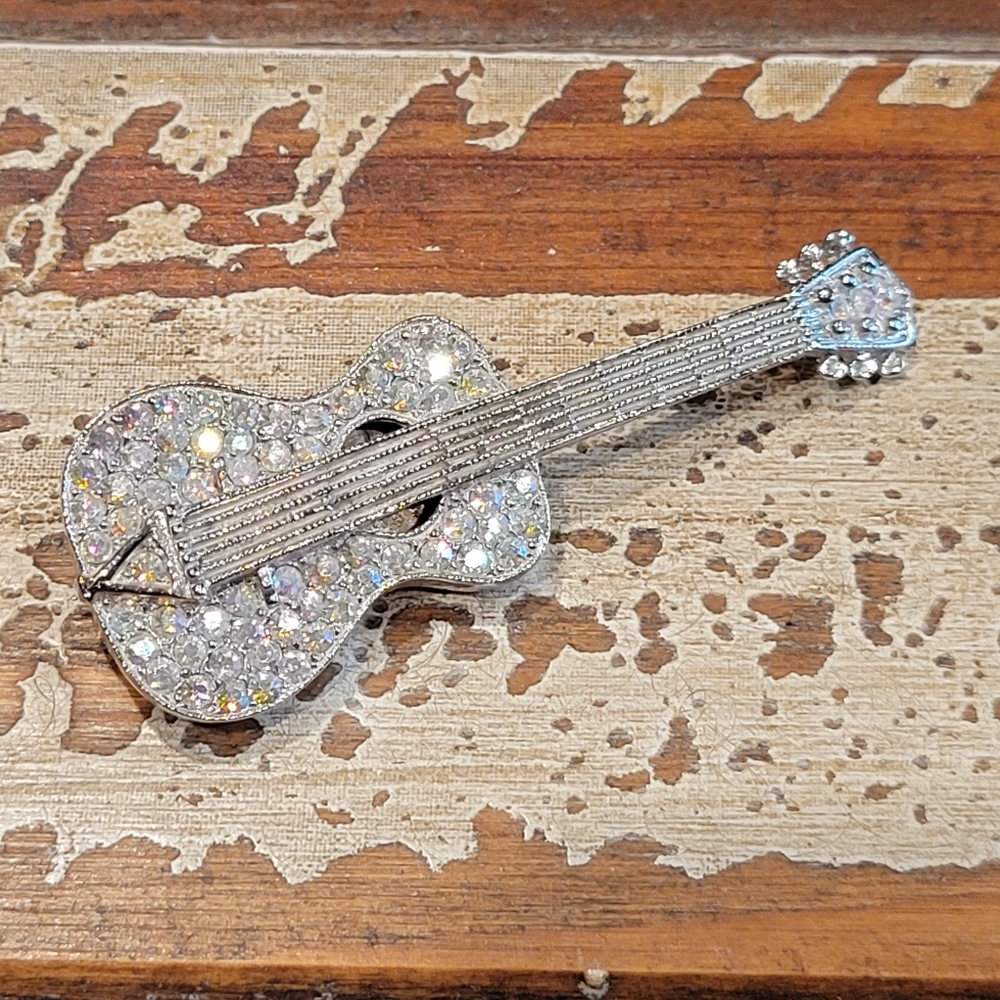 Vintage rhinestone filled silver guitar brooch